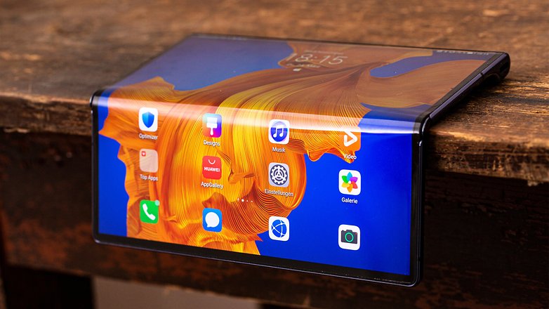 Huawei Mate XS semi folded on the edge of a table