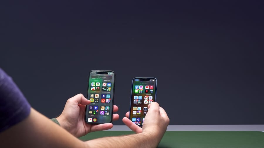 iPhone 14 Pro - In Hand next to iPhone 13 Mini